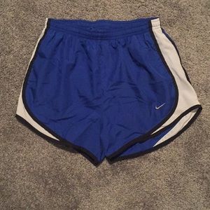 Blue Nike running shorts